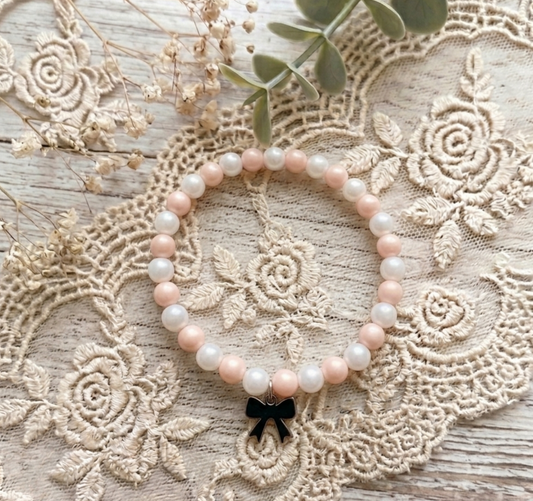 Pulsera de bolitas irisadas con entre pieza de acero